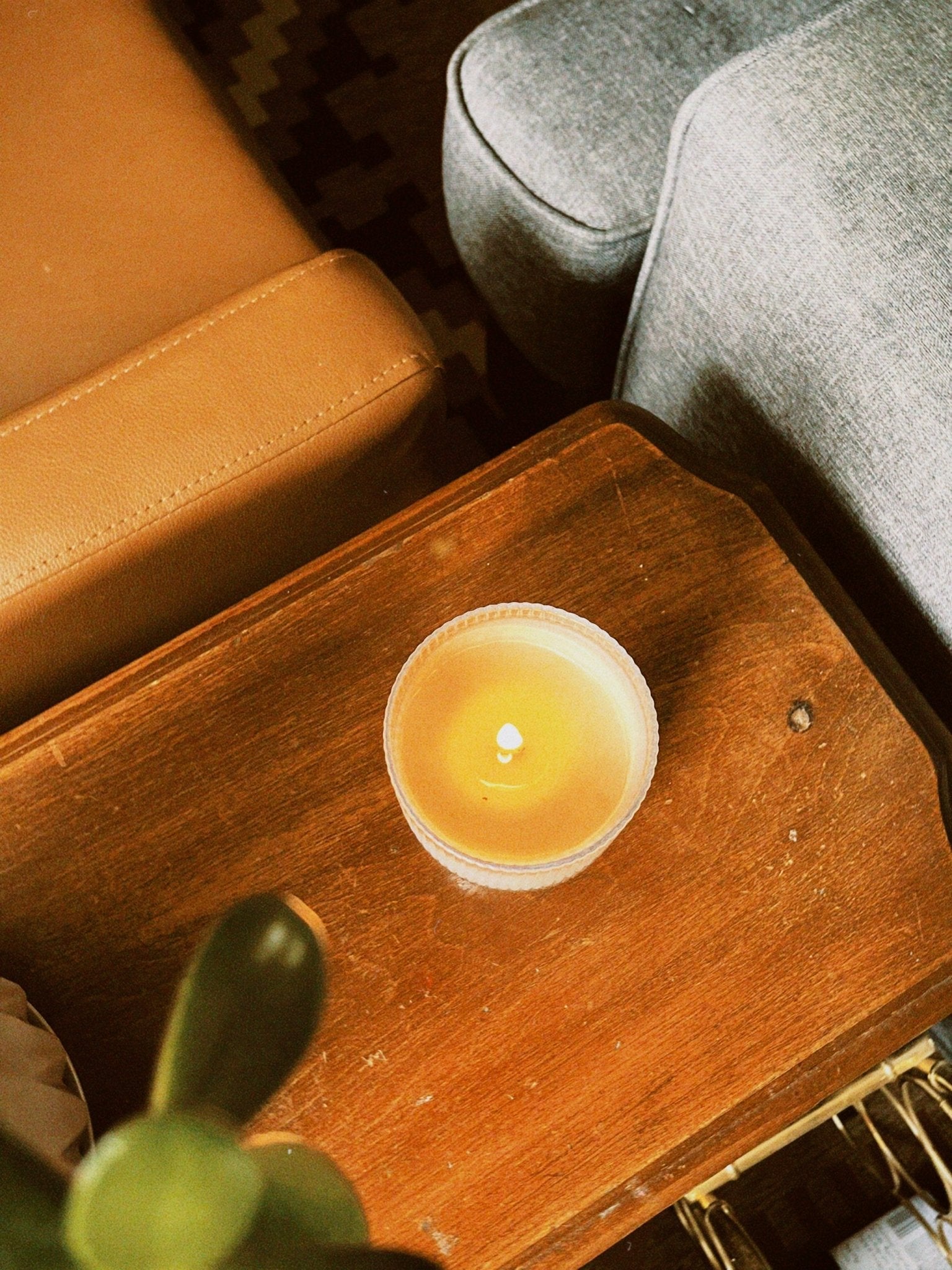 Top down view of a Light Provisions tumbler candle burning with a slight tunnel starting to form