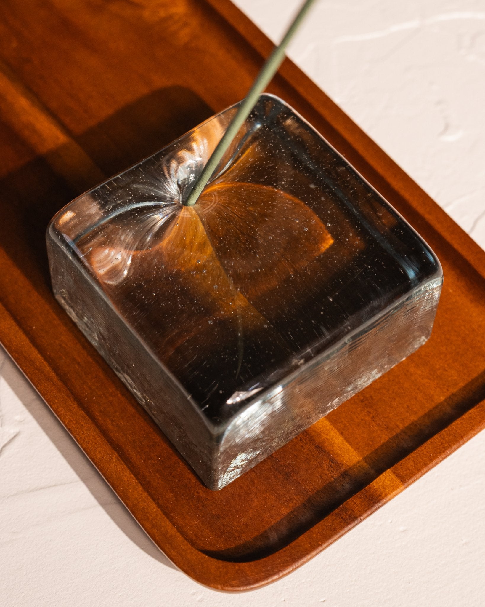 IYE recycled glass incense holder close up on acacia wood tray