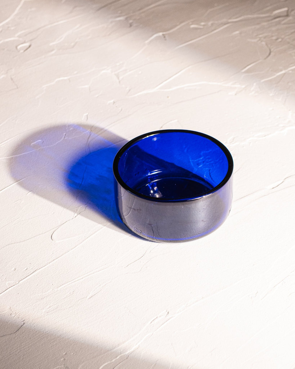 Blue reclaimed bottle glass dish made from locally collected bottle glass