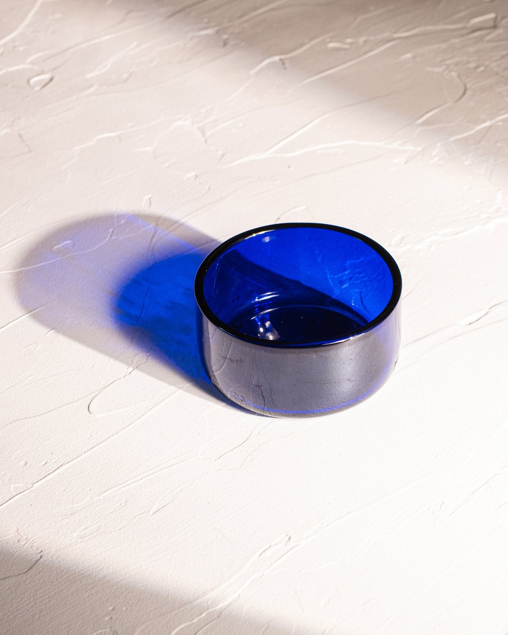 Blue reclaimed bottle glass dish made from locally collected bottle glass