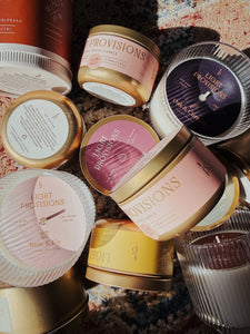 Collection of Light Provisions Blunder candles in many sizes and scents on vintage rug background