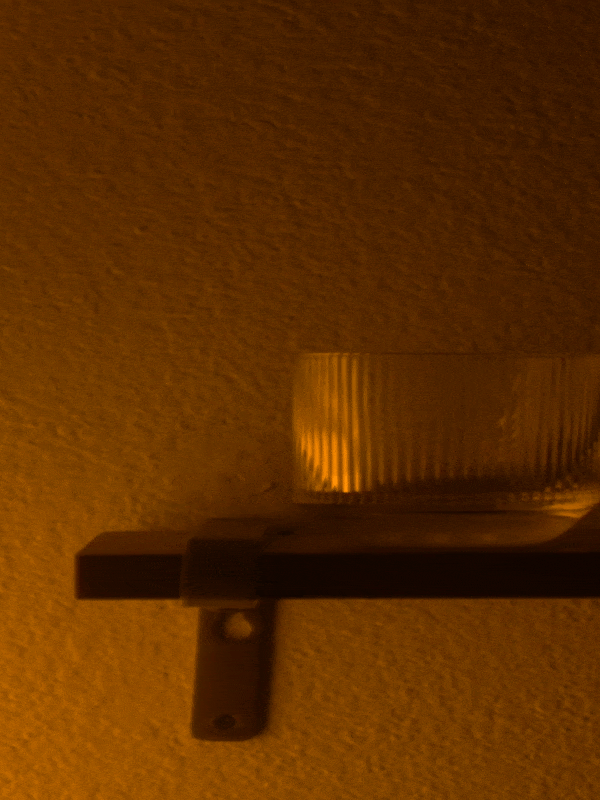 gif of a hand inserting a refill candle into light provisions glassware