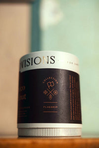 Side view of Tobacco & Walnut flagship collection candle packaging with gold foil logo and collection icons