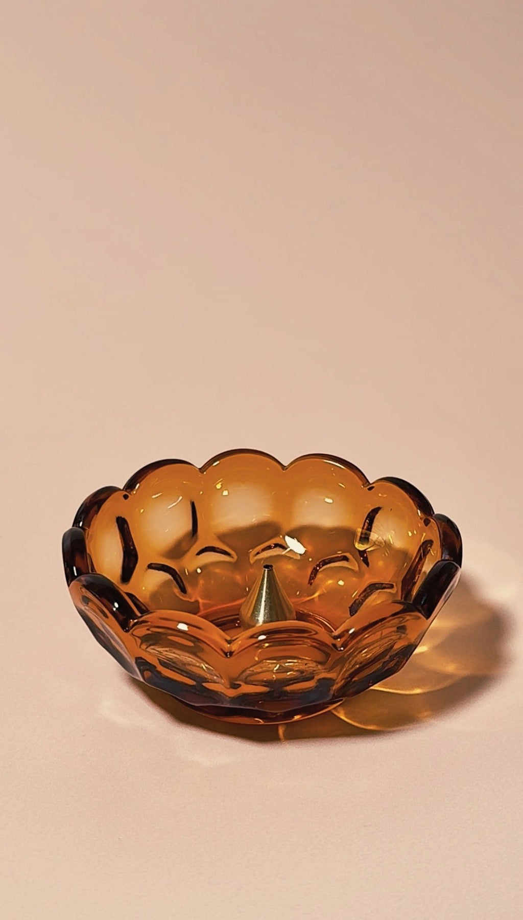 vintage amber glass bowl with scalloped edge on a beige background | Provincial Amber Collection by Imperial Glass