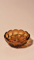 vintage amber glass bowl with scalloped edge on a beige background | Provincial Amber Collection by Imperial Glass