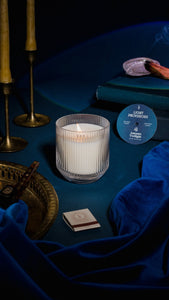 Autumn Twilight candle in signature glass tumbler with travel tin, brass candlesticks and blue velvet styling