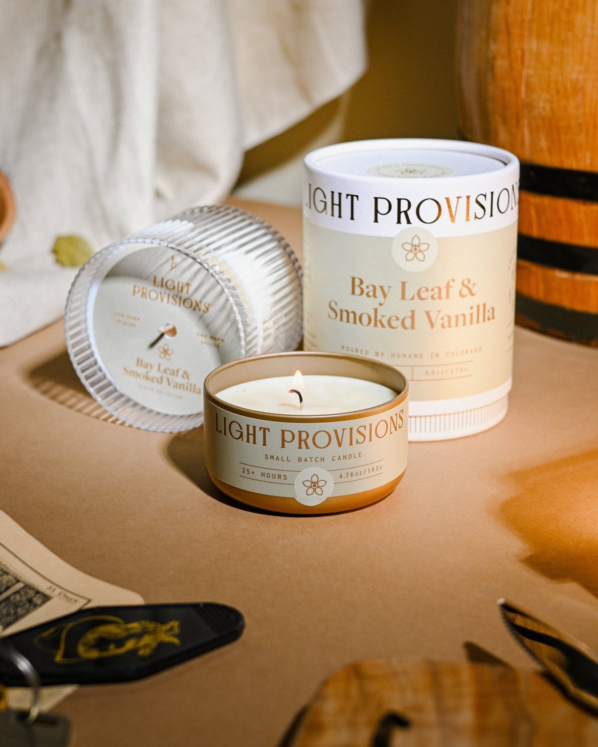 Bay Leaf & Smoked Vanilla soy candle by Light Provisions, Winter Collection — with box on tabletop