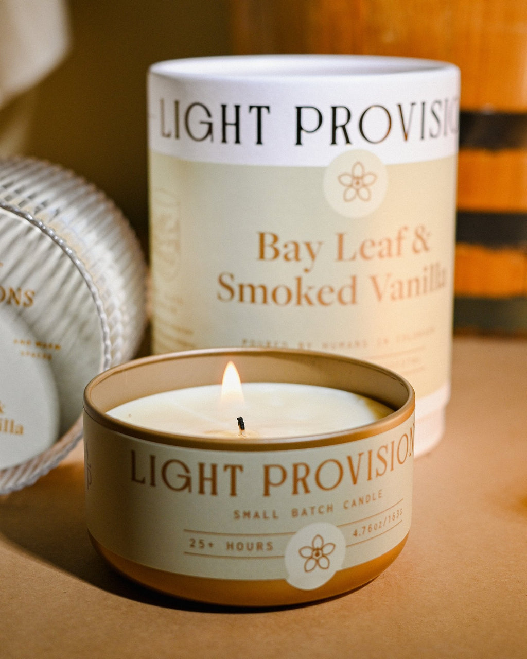 Bay Leaf & Smoked Vanilla soy candle by Light Provisions, Winter Collection — close-up of candle tin