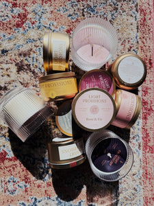 Collection of Light Provisions Blunder candles in many sizes and scents on vintage rug background