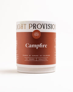 Light Provisions Campfire candle in 9.5 oz glass tumbler, rust-colored label, hand-poured in Colorado Springs.