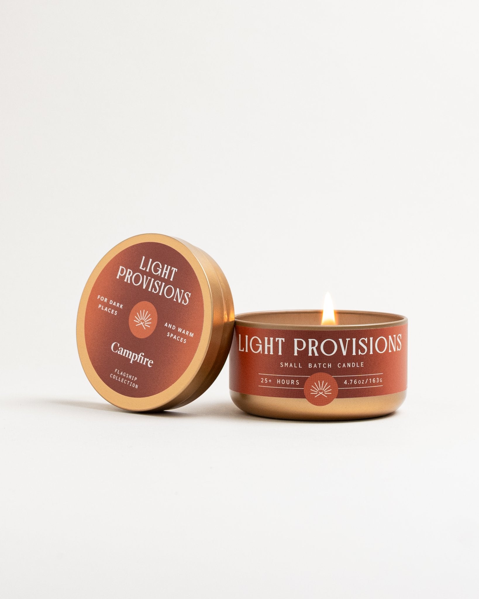 Campfire Candle 4.75 oz travel tin with brown label and gold lid on white background
