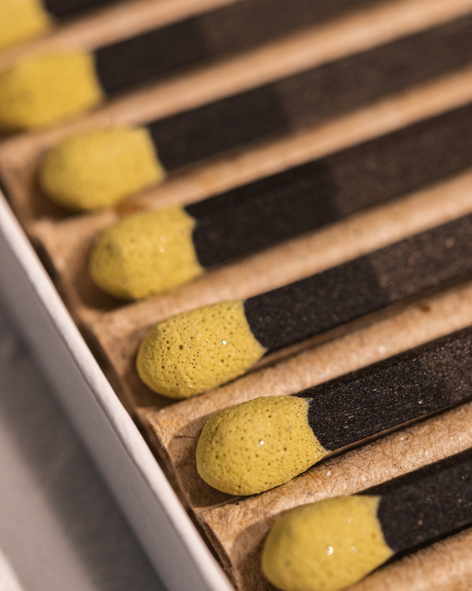 Close-up of HIBI Hinoki incense matches with sulfur strike tips and Japanese cypress fragrance