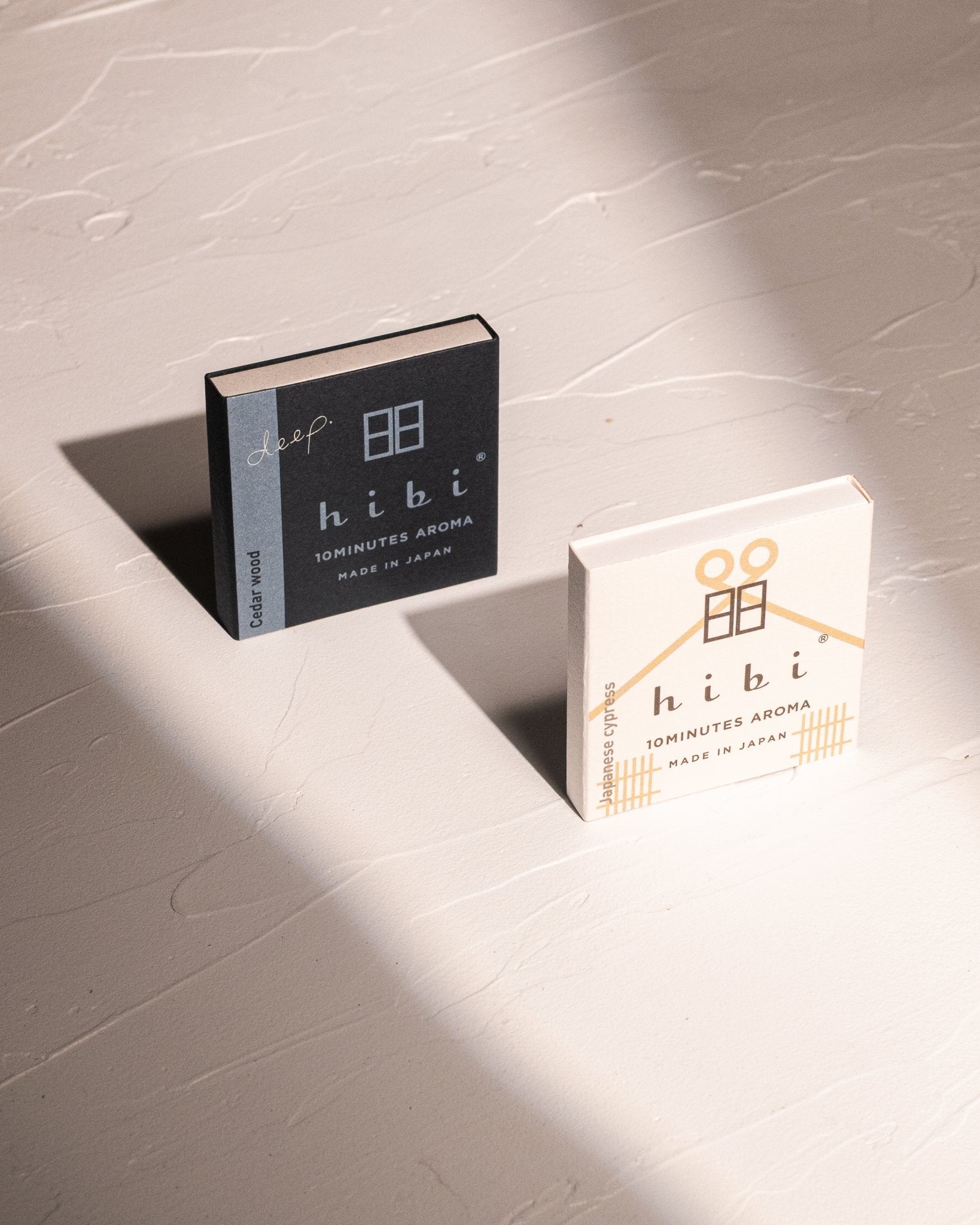 HIBI incense matches in Cedarwood and Hinoki scents with strike boxes and felt burning mats