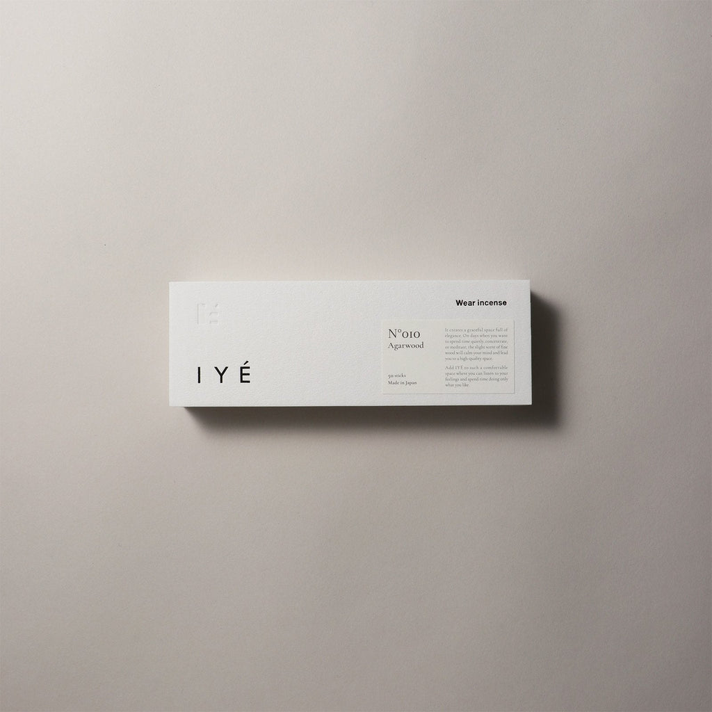 IYé agarwood incense packaging on a beige background