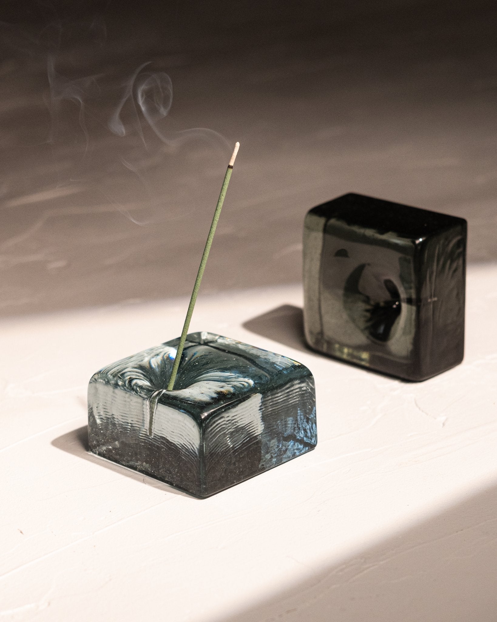 IYE recycled glass incense holders in blue-gray and black-blue, handmade in Japan