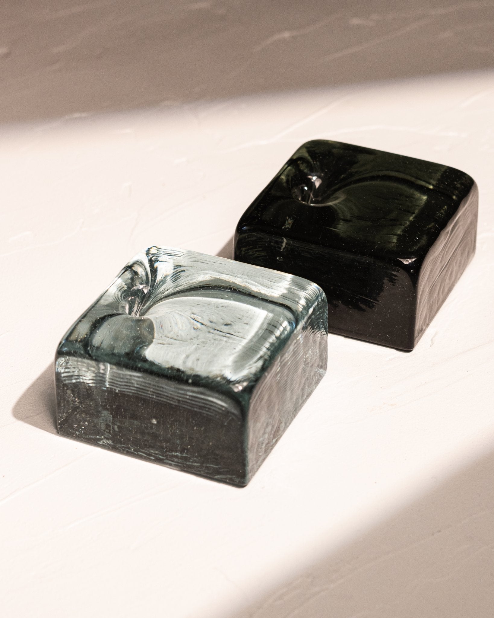 Blue-gray and black-blue IYE incense holders made from recycled CRT glass