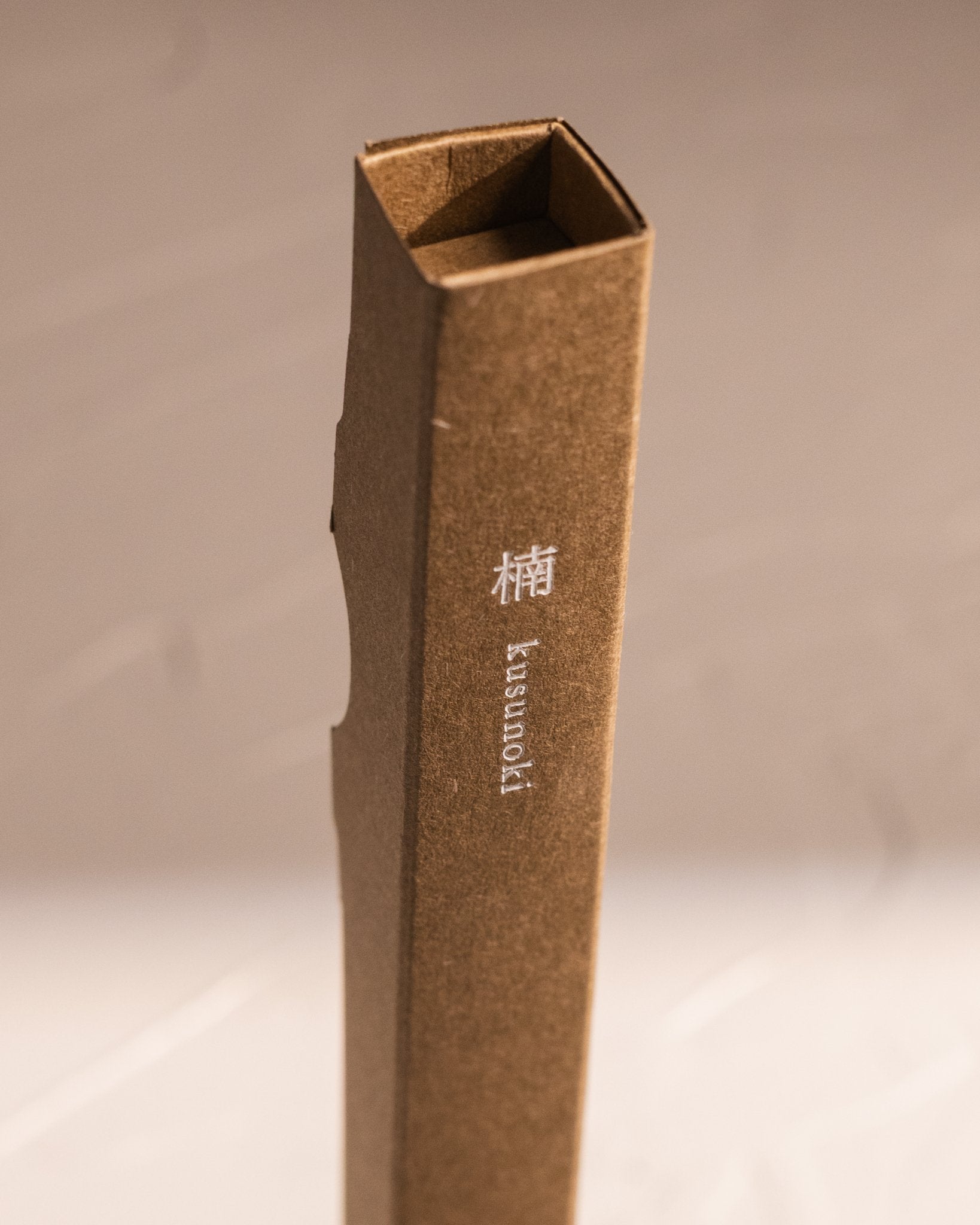 Close up of Kousaido Waboku Kusunoki incense package made from a single folded paper sleeve