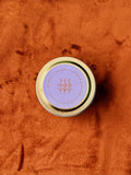 Light Provisions Lavender & Balsam Candle in its purple-labeled vessel
