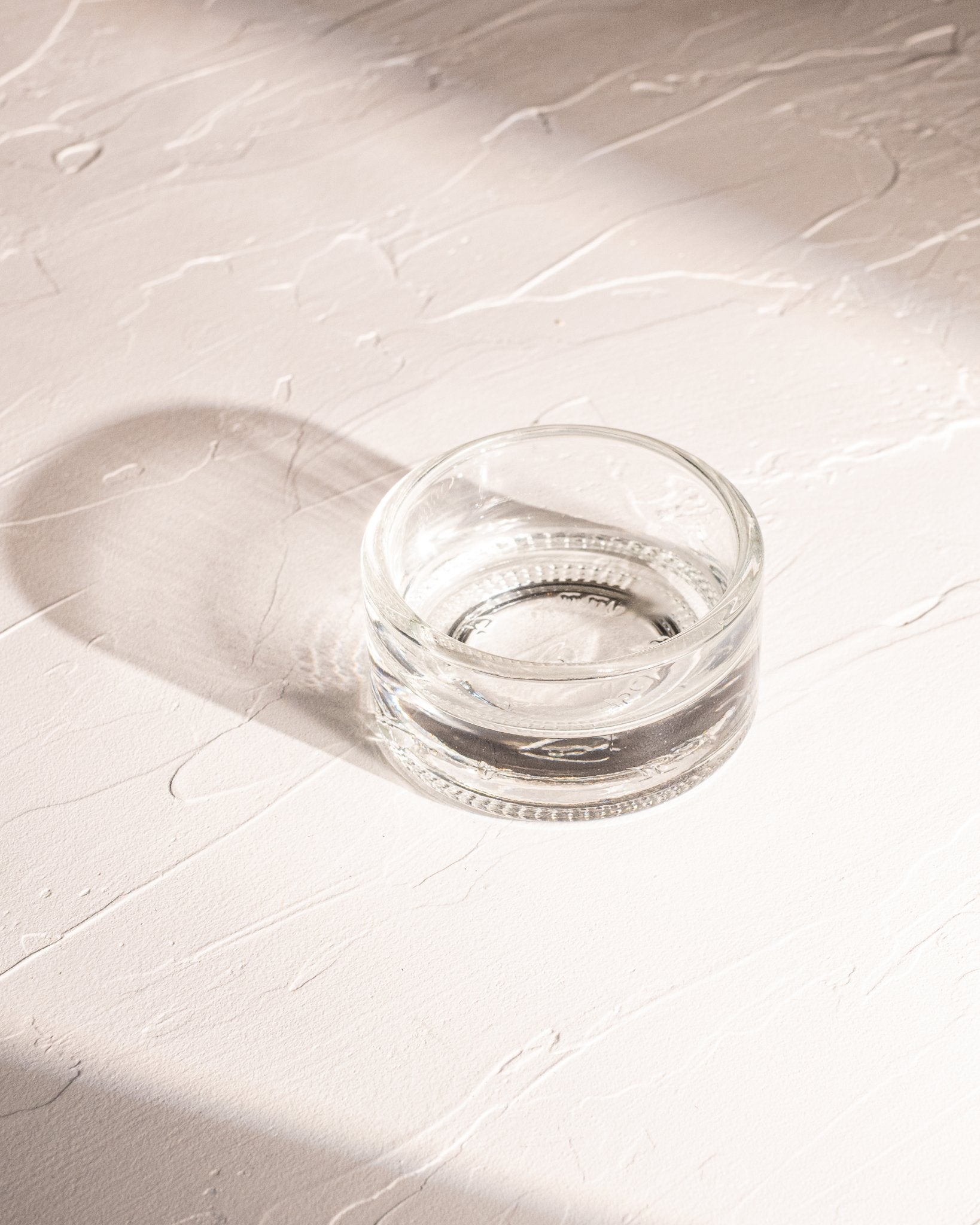 Clear reclaimed bottle glass dish made from locally collected spirits bottle glass