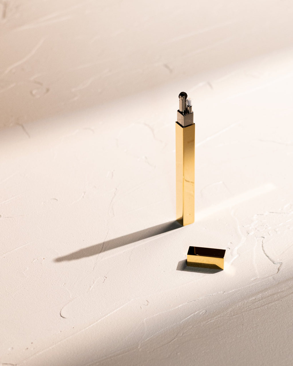 Gold Tsubota Pearl Queue stick lighter with cap removed