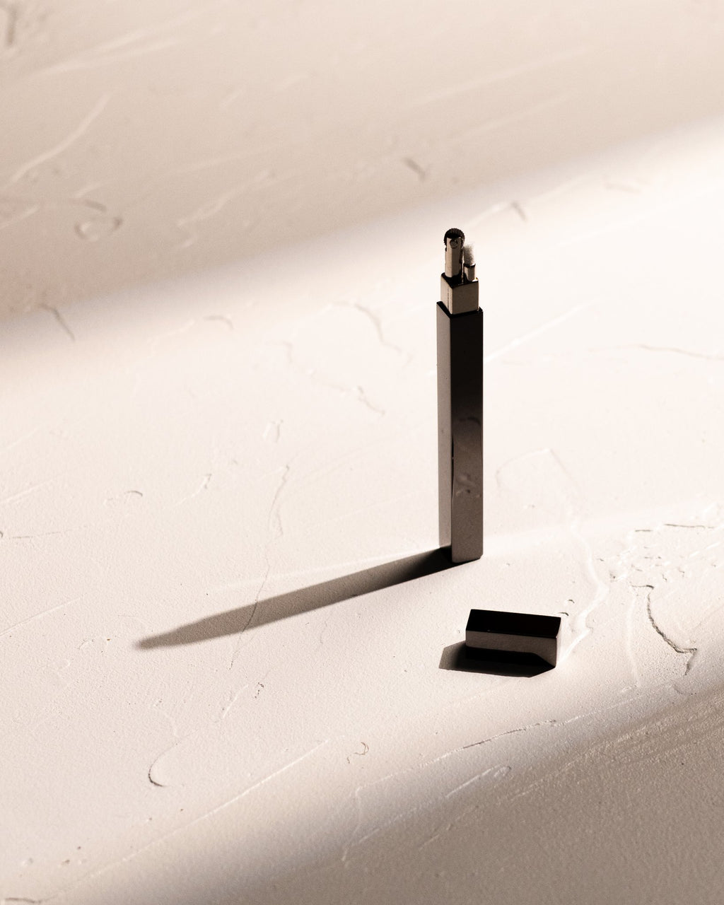 Black Tsubota Pearl Queue stick lighter with cap removed