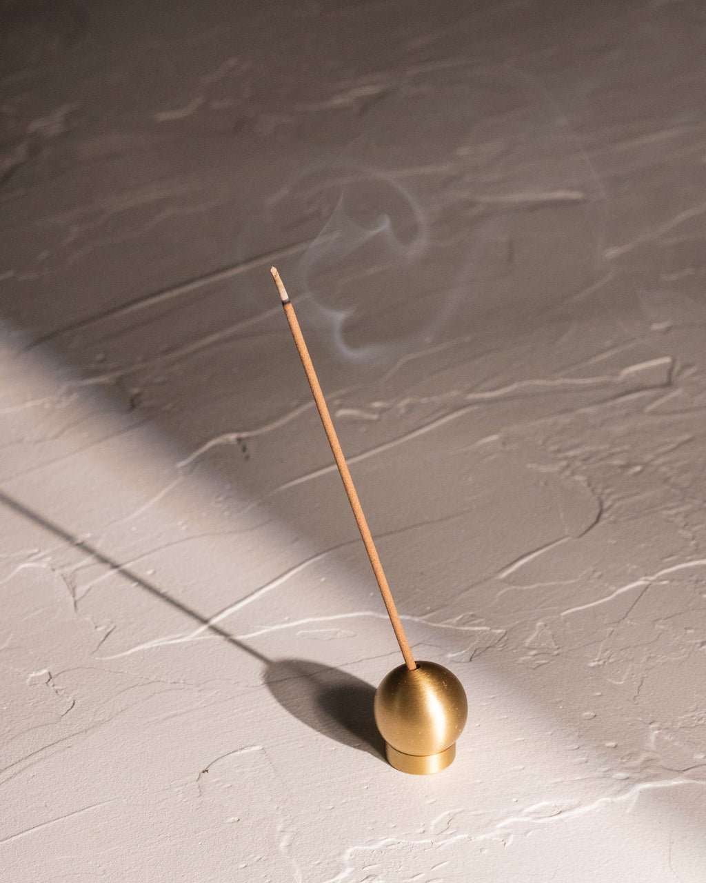 Sphere brass adjustable incense holder with burning Japanese incense stick