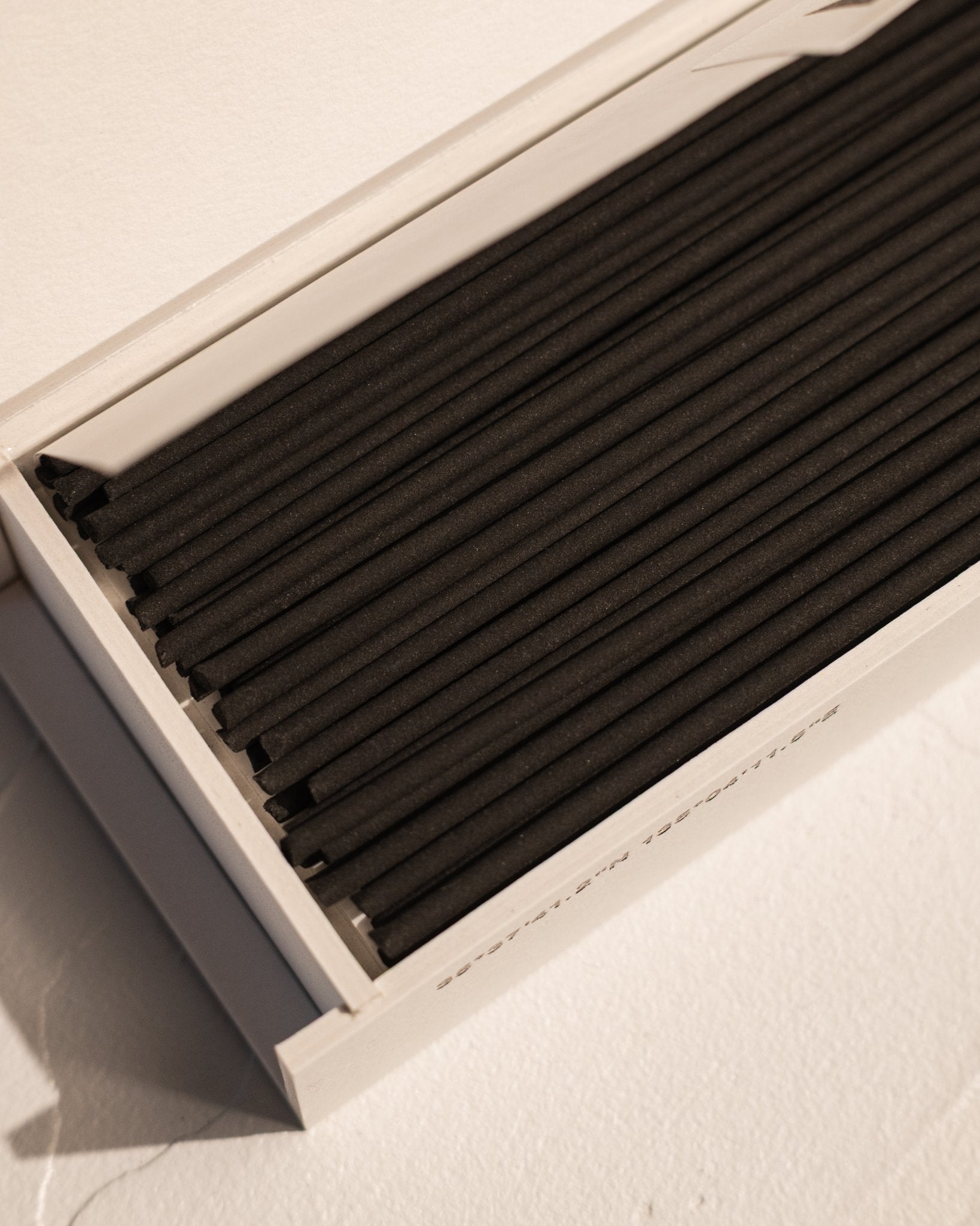 Close-up of IYÉ No. 001 Birth incense sticks in presentation box