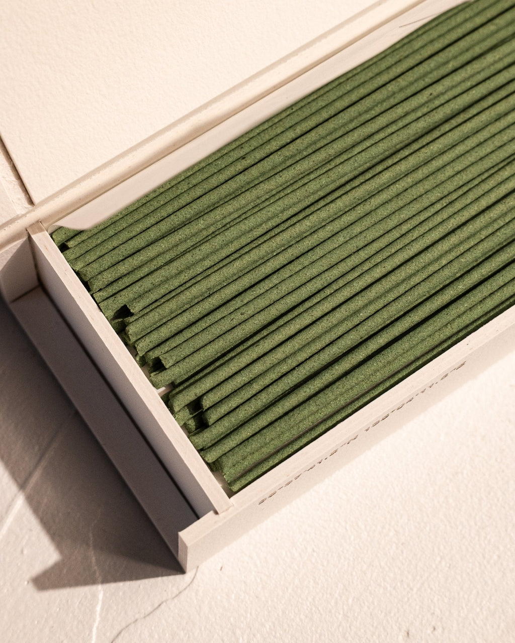 Close-up of IYÉ No. 007 Sandalwood coreless incense sticks in presentation box