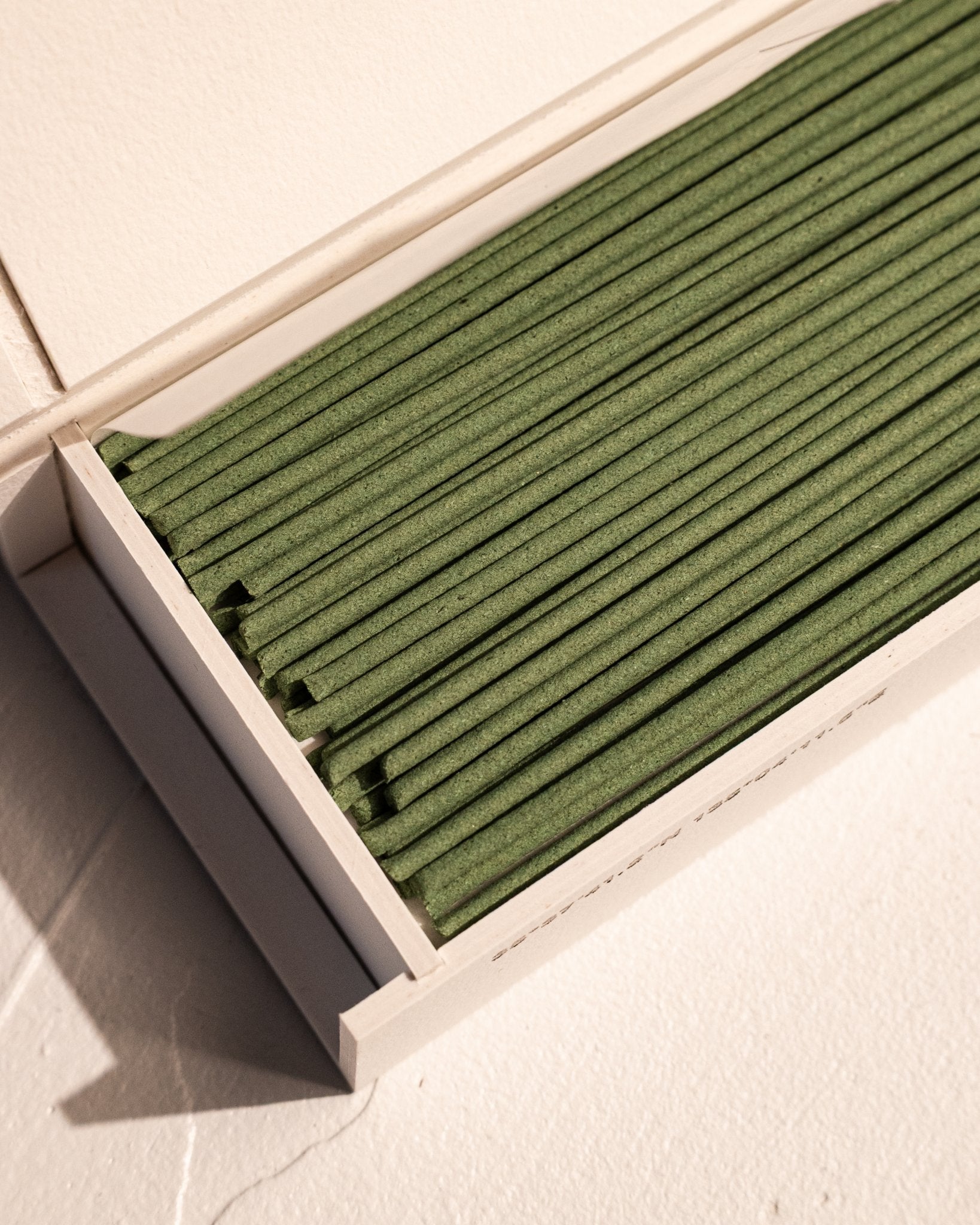 Close-up of IYÉ No. 007 Sandalwood coreless incense sticks in presentation box