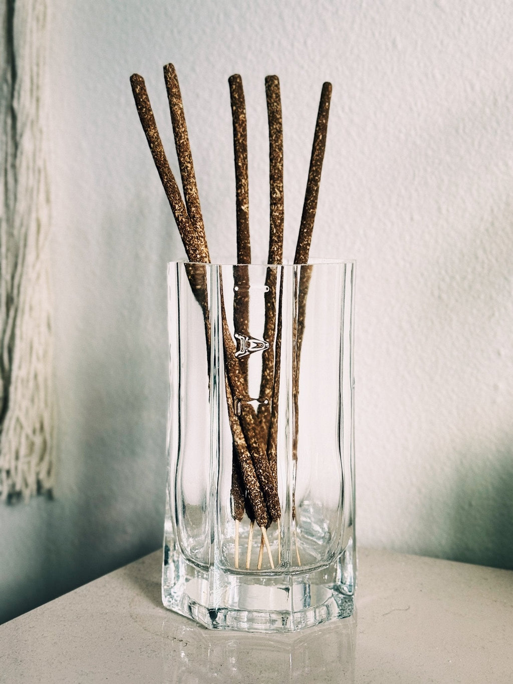 The cleaned Saint Germain glass repurposed for incense sticks. The tall profile make it ideal for storing Incense