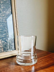 Upcycled 10 oz glass vessel made from liquor bottles with thick ridged base.