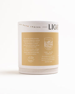 Back panel of Palo Santo & Ginger packaging highlighting 12 oz glass tumbler vessel details, on white background.