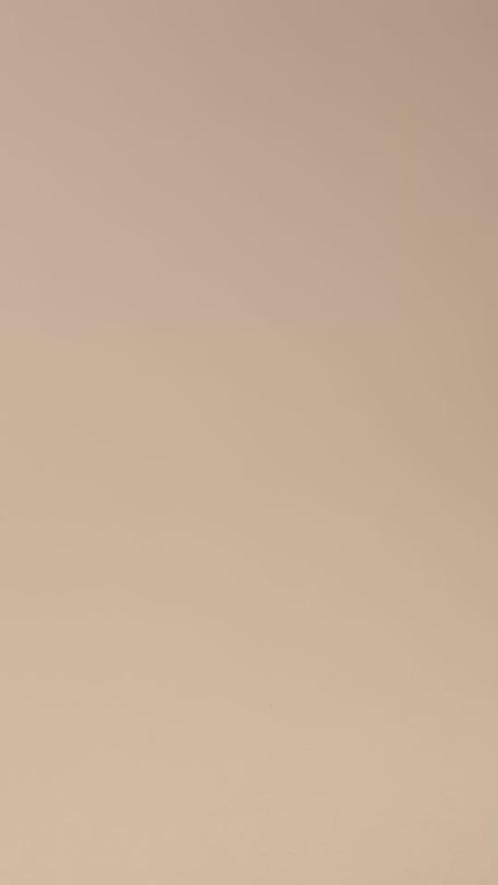 hand placing vintage amber scalloped dish in front of camera, showing approximate size of bowl