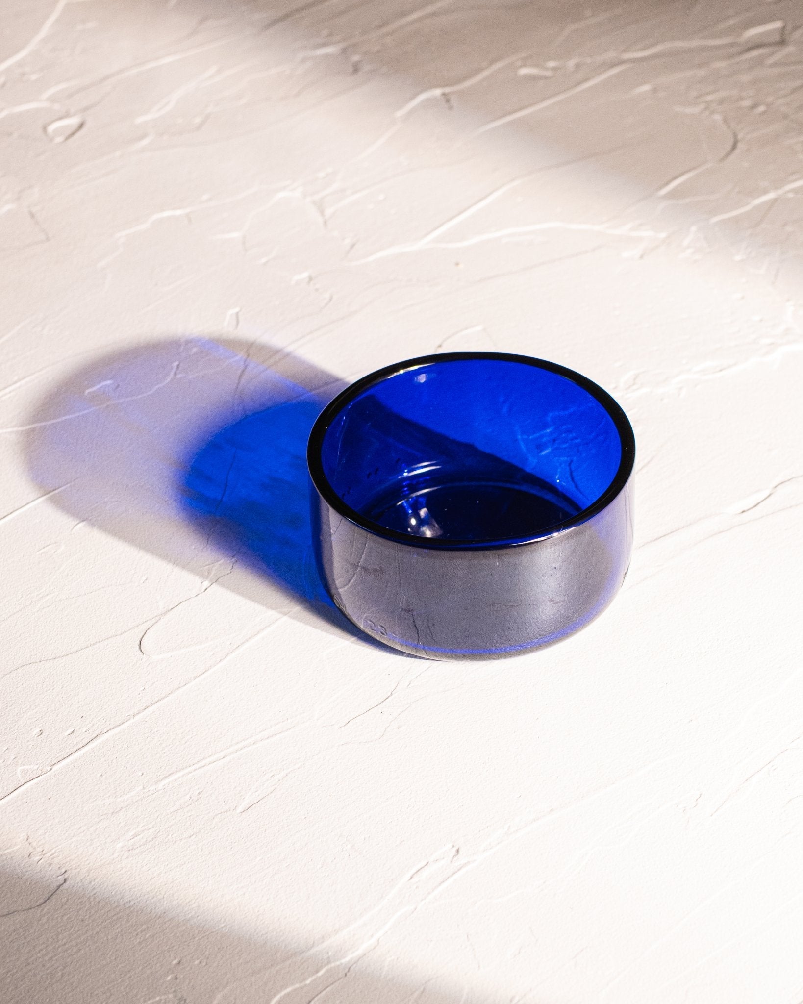 Blue reclaimed bottle glass dish made from locally collected bottle glass