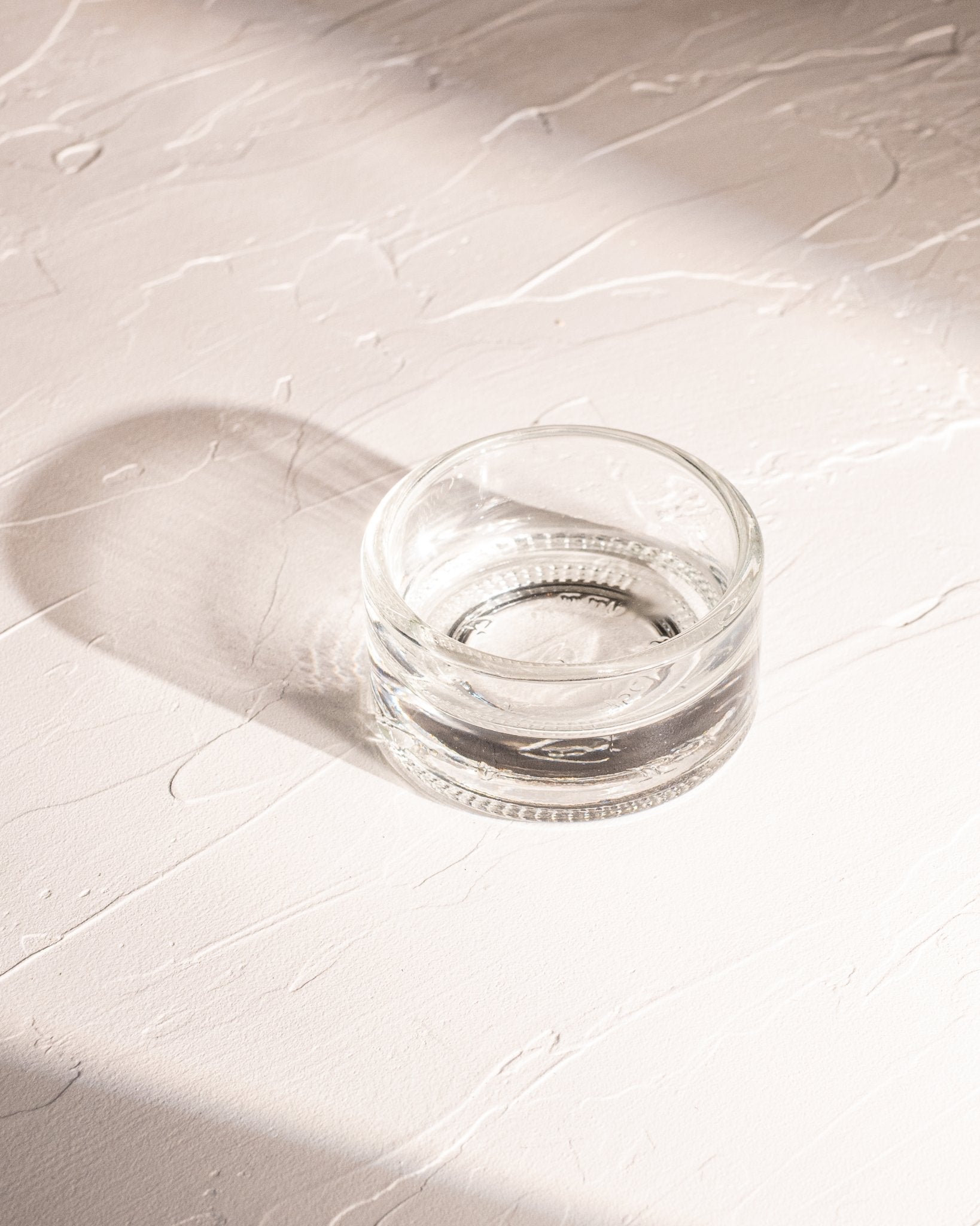 Clear reclaimed bottle glass dish made from locally collected spirits bottle glass