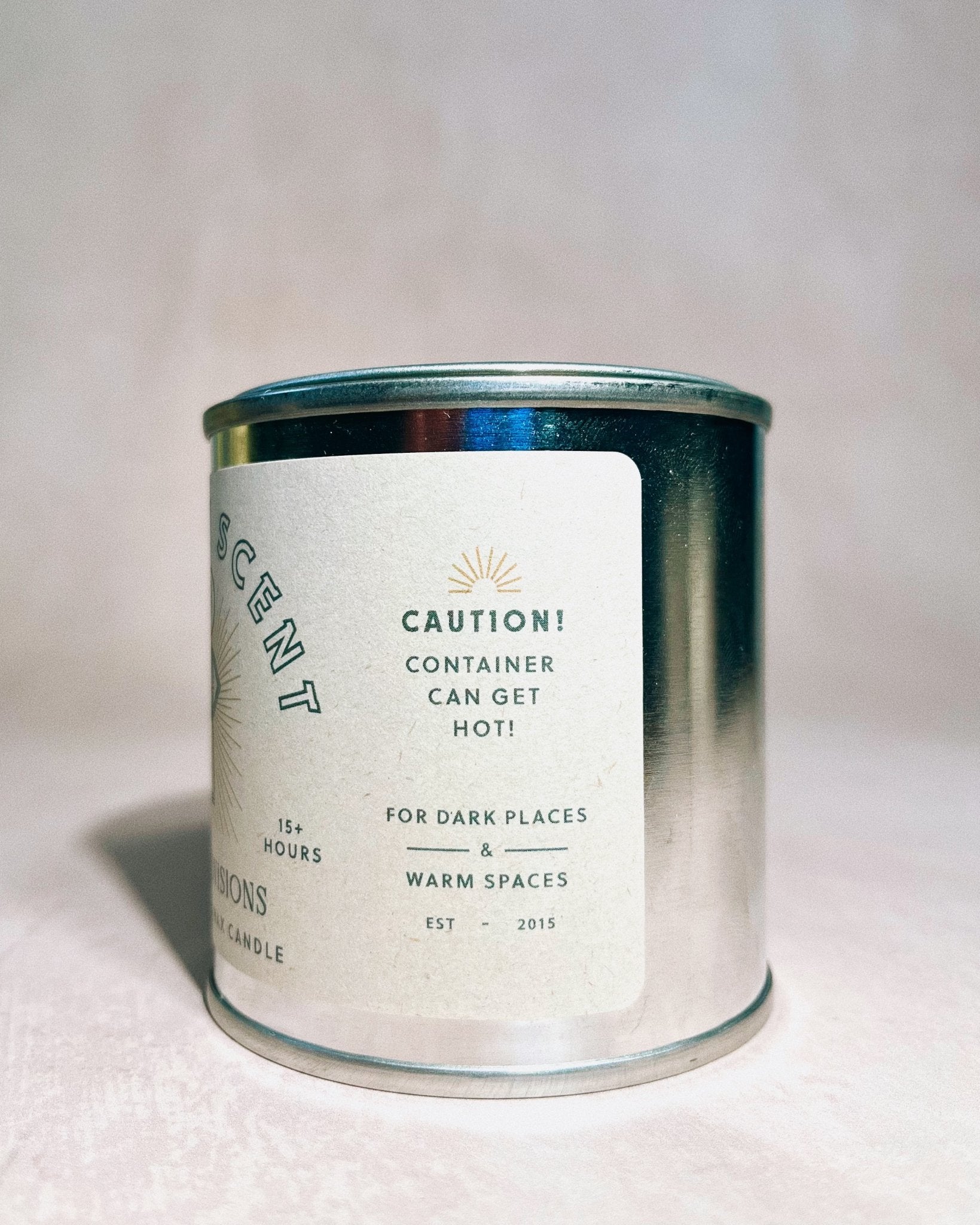 Candle container with label on a light background