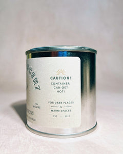 Candle container with label on a light background