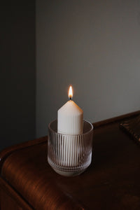 Autumn Refill Collection candle burning in ribbed glass tumbler on wooden table