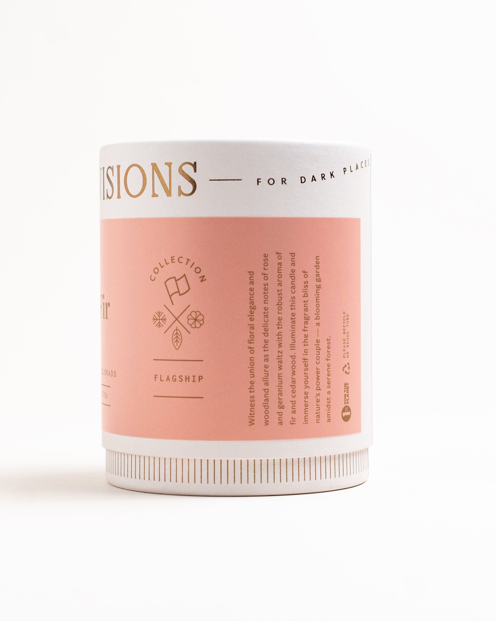 Side view of Rose & Fir candle in glass jar with pink label on white background with product copy