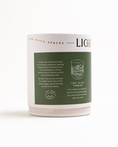 Back of Rosemary & Cedar packaging highlighting 12 oz glass tumbler details, about us, on white background.