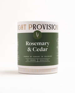 Light Provisions Rosemary & Cedar 9.5 oz tumbler candle packaging, front green label, on white background.
