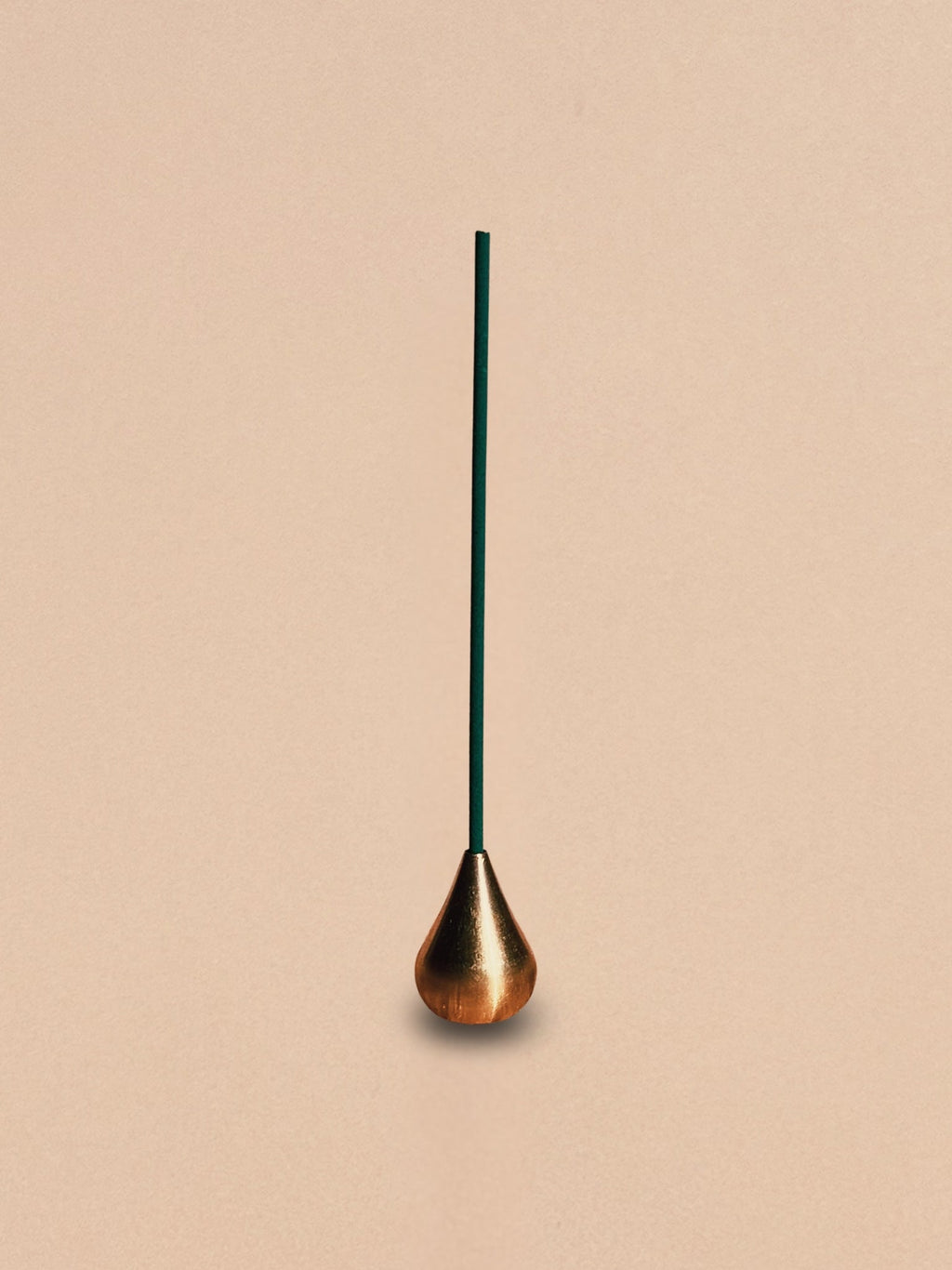 Brass waterdrop incense holder shown alone against a neutral background.