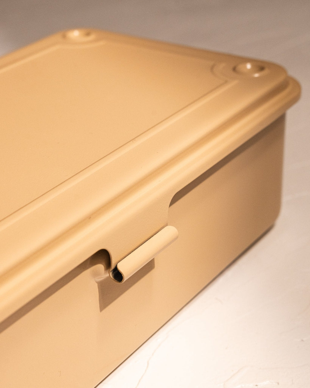 Close-up of Toyo Steel T-190 storage box latch and seamless steel construction