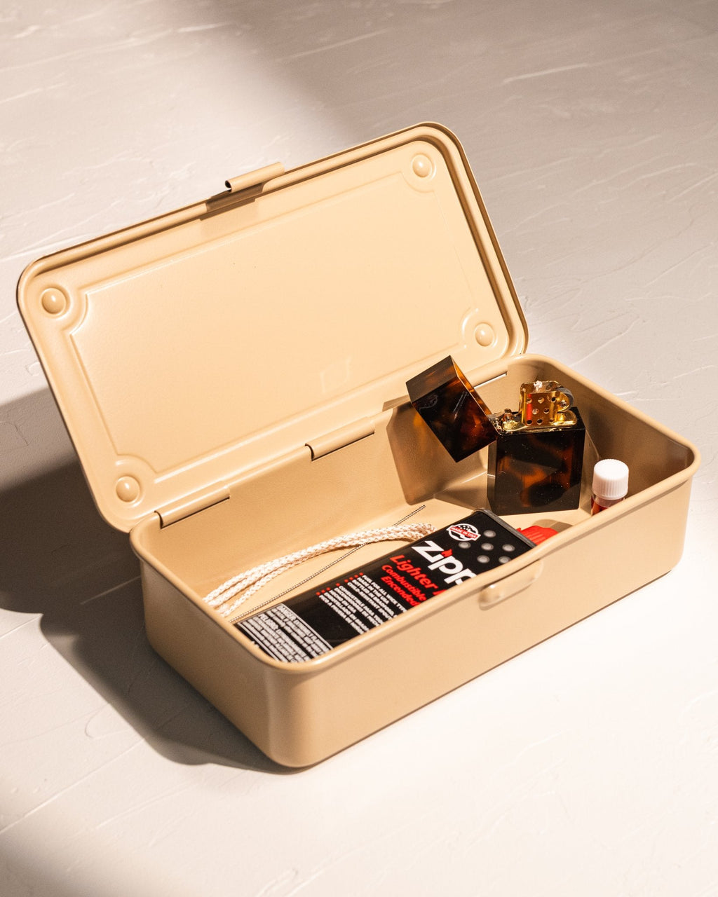Toyo Steel T-190 storage box holding lighter supplies and candle care accessories