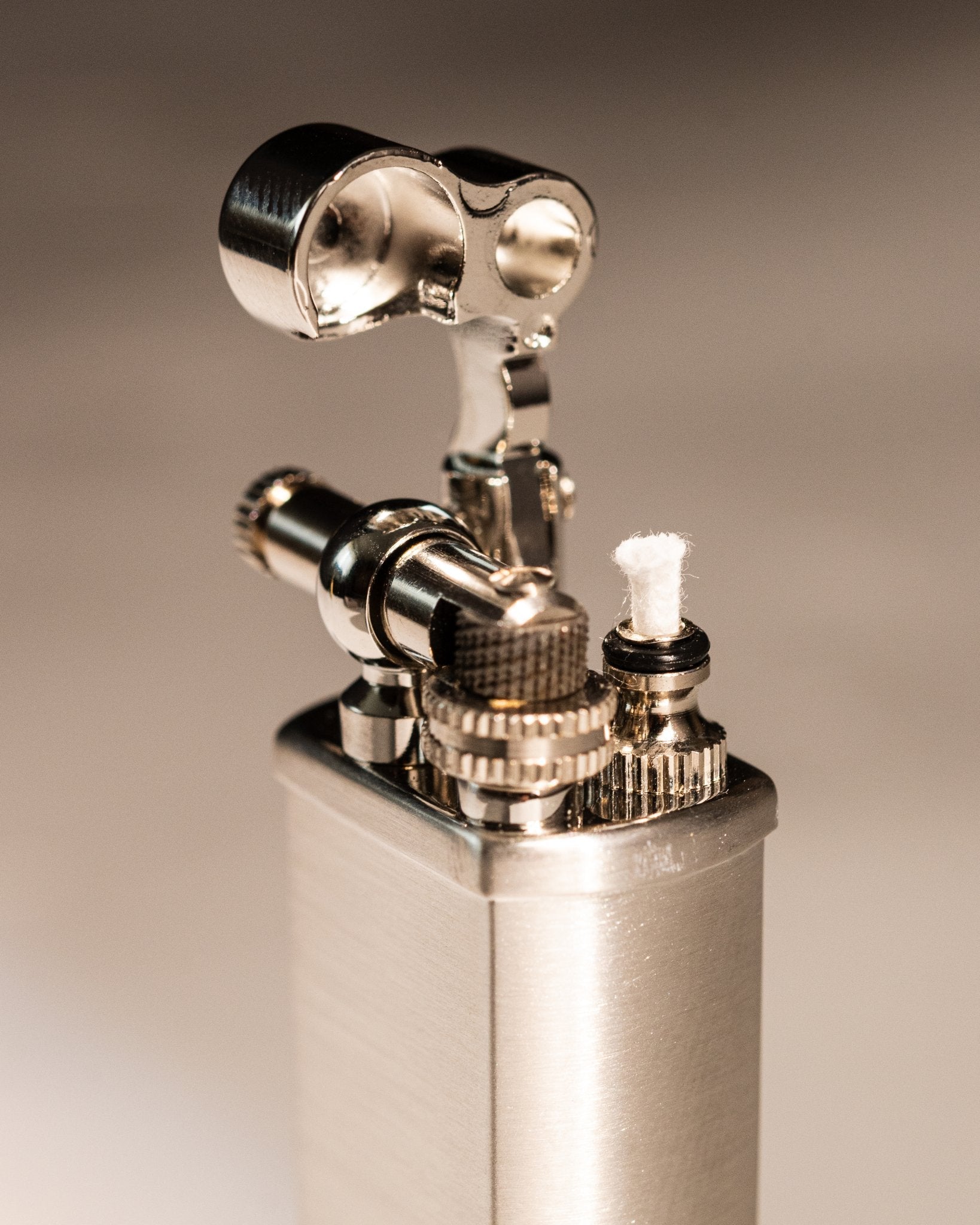 Close-up of Tsubota Pearl Bolbo silver lighter ignition assembly 