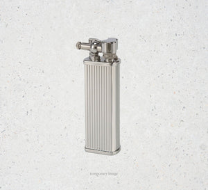 Silver lighter on a textured white background