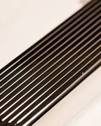 Close-up of silver Bolbo Striped lighter showing precision fluted metalwork