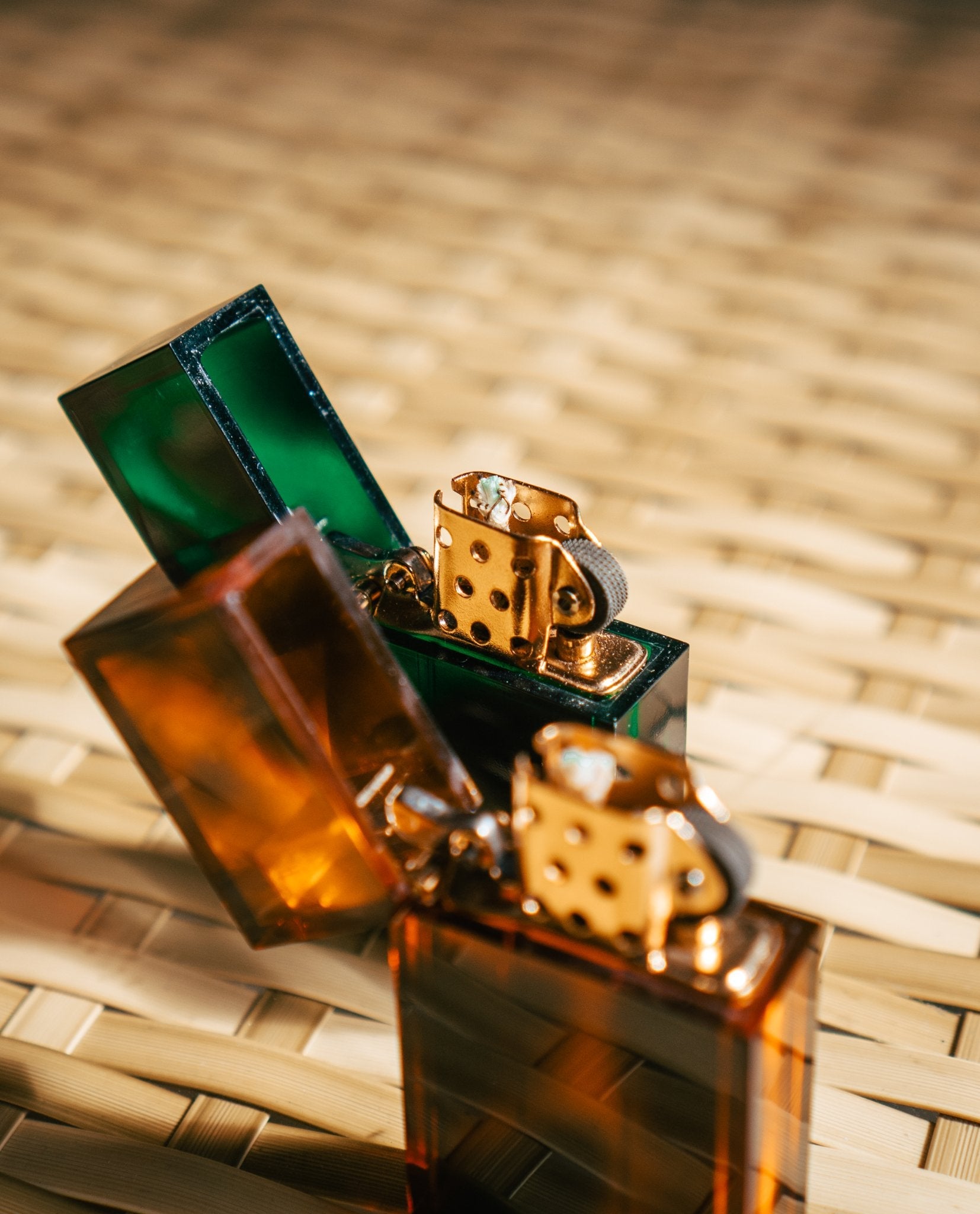 Close up of Tsubota Pearl marble emerald and amber tortoise lighters 