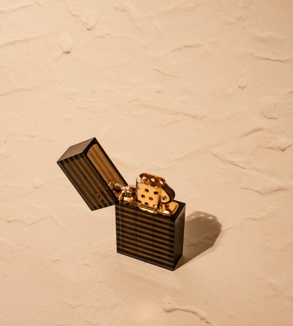 Black Tsubota Pearl Latitude lighter with open cap