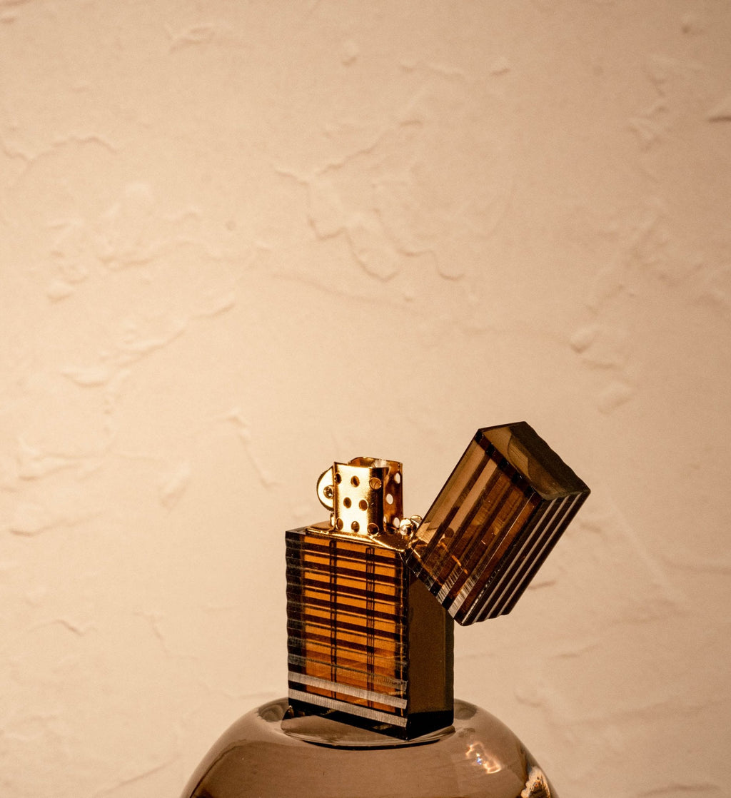 Black Tsubota Pearl Latitude lighter with lid open and gold interior body